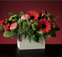  Floral arrangement with red and green flowers in a white box against a red background
